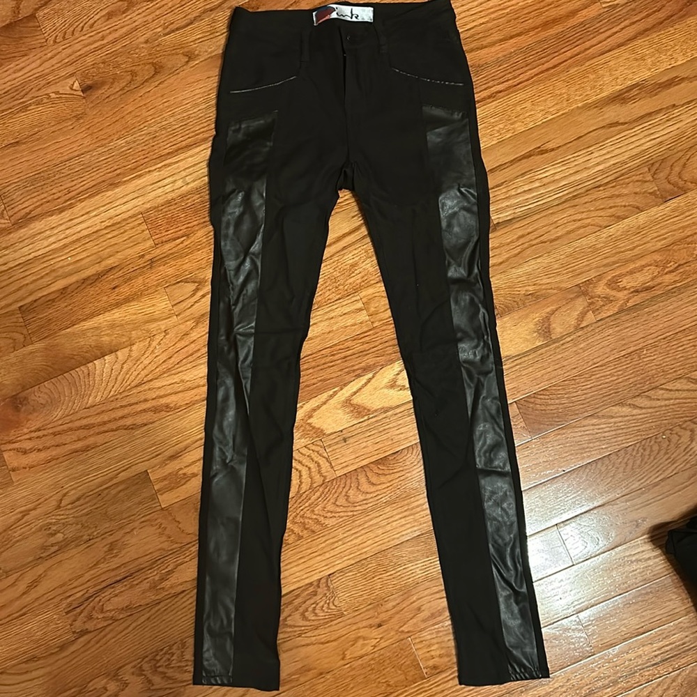 Black begging jeans with leather down the sides of the legs